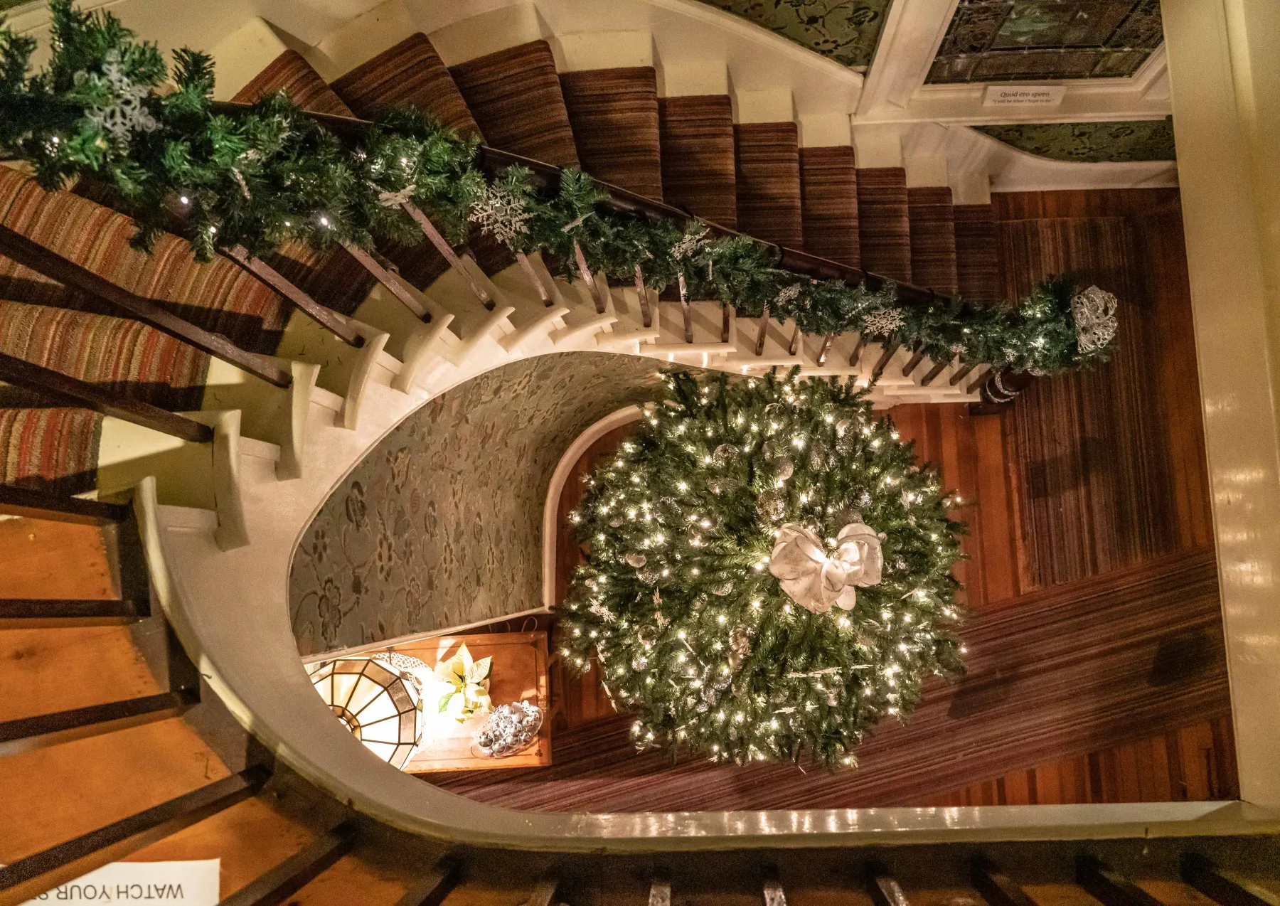 Interior stairway decorated for the holidays at Boothe Park